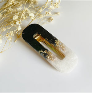 Handmade resin clip. Gold leaf white and black