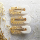 Handmade resin clip. Gold leaf white